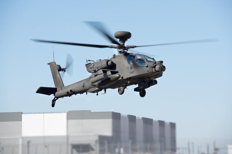 Boeing AH-64 Apache helicopter on its first flight 