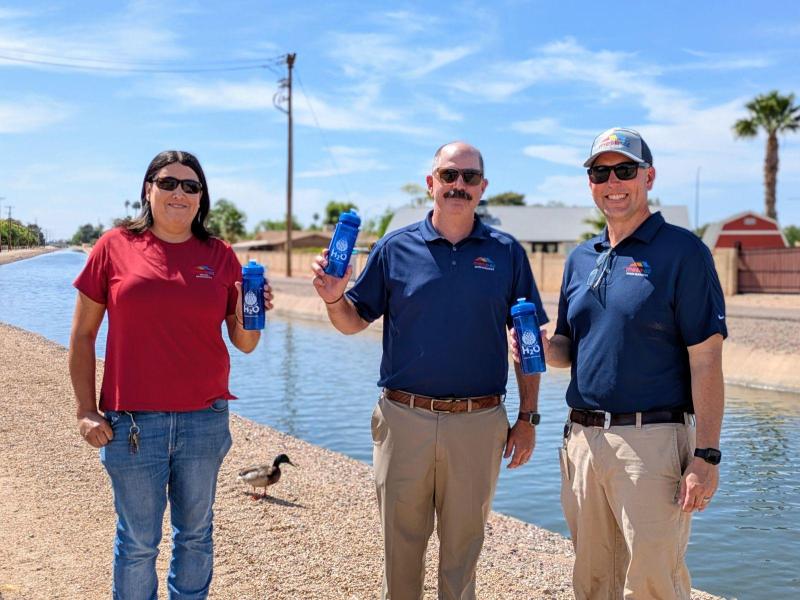 Front cover photo for City of Mesa 2025 Water Quality Report with 3 Water Resources employees