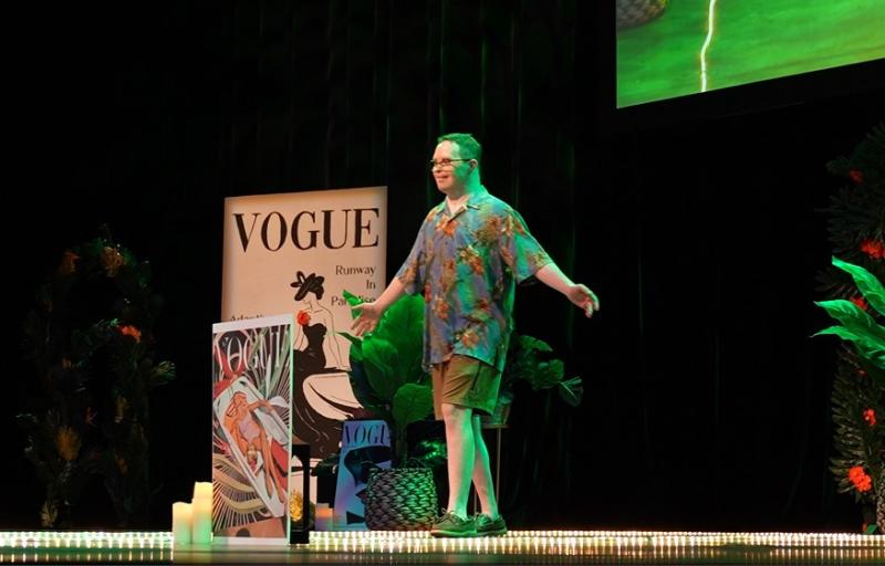 Photo of young man who is a model on the runway for Annual Adaptive Fashion Show